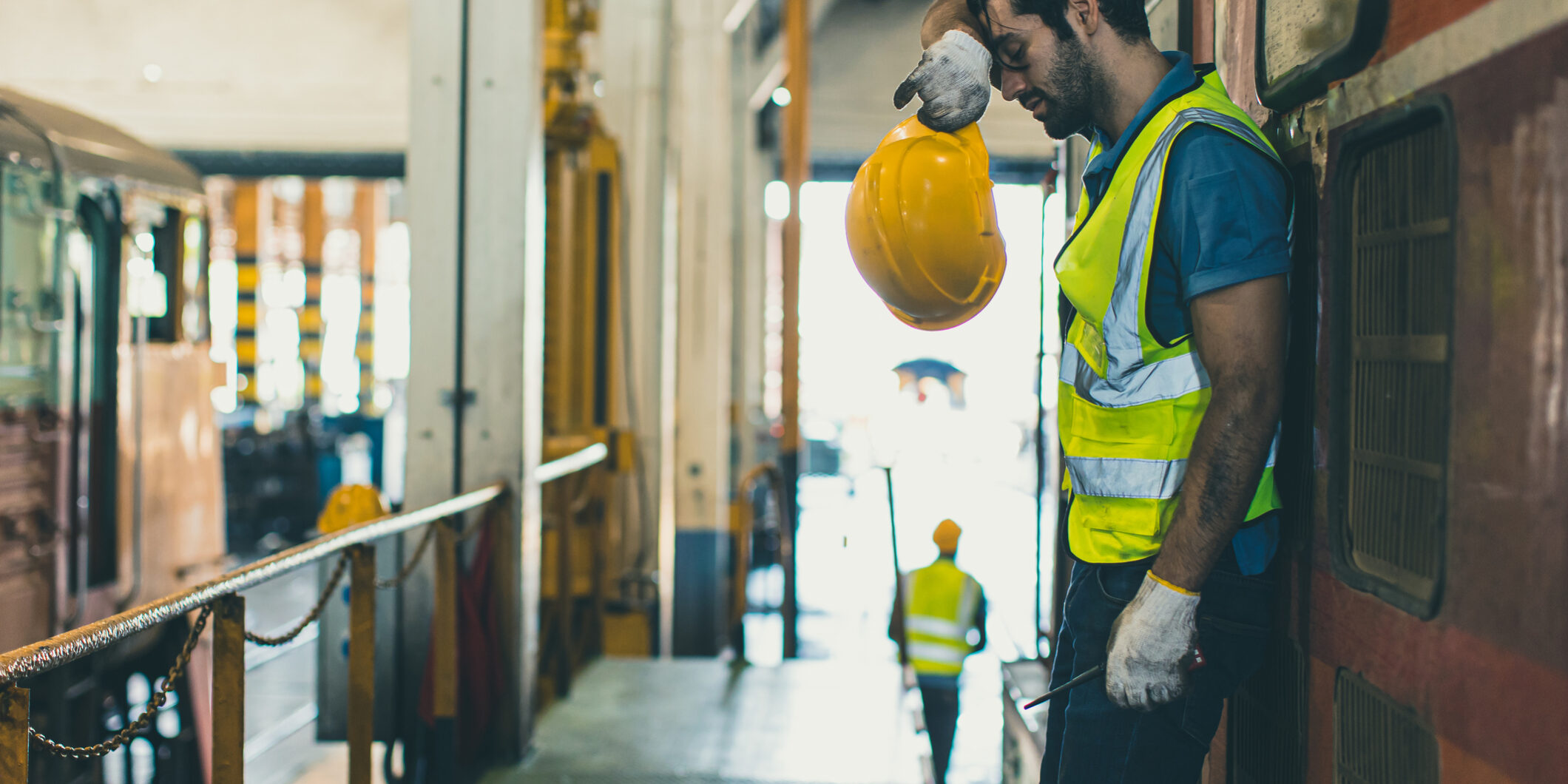 Tired exhausted worker hard work, Locomotive engineer mechanic staff feel fatigue work in train repair shop service station dirty hot workplace machine factory.